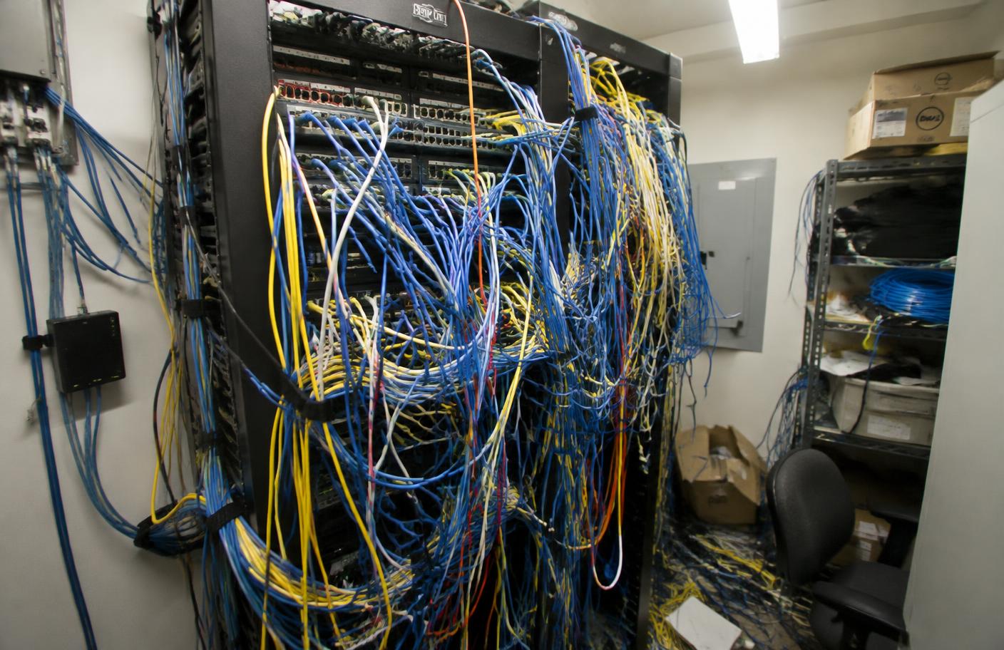 Messy network closet before
